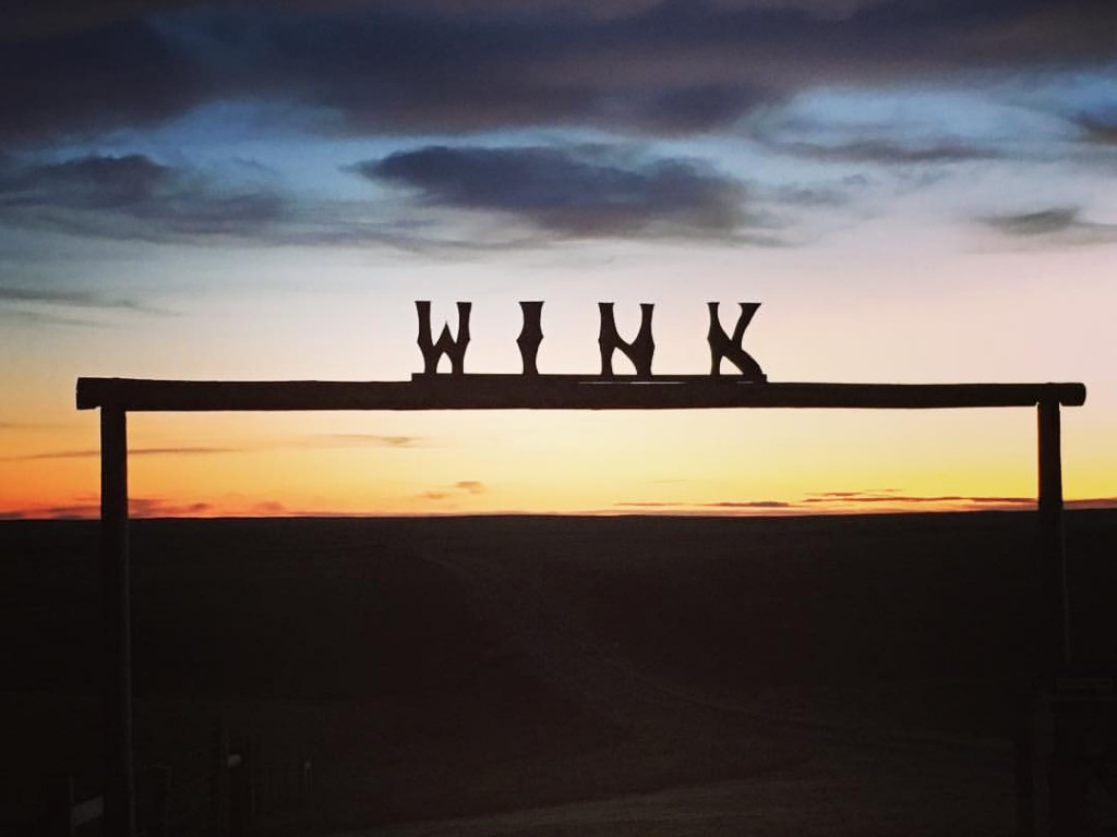 Wink sign sunset